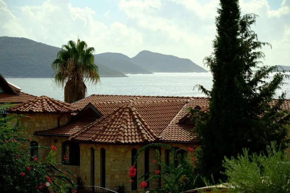 Illustrative photograph: Mediterranean hillside villa with sea and mountain views